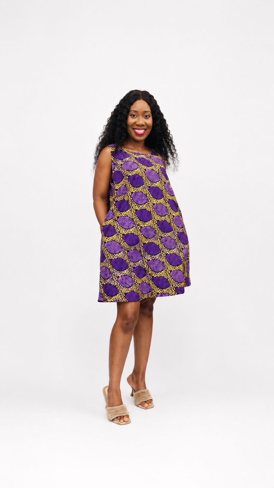 Front view of the purple and yellow A-line mini dress featuring a sleeveless cut and side pockets.