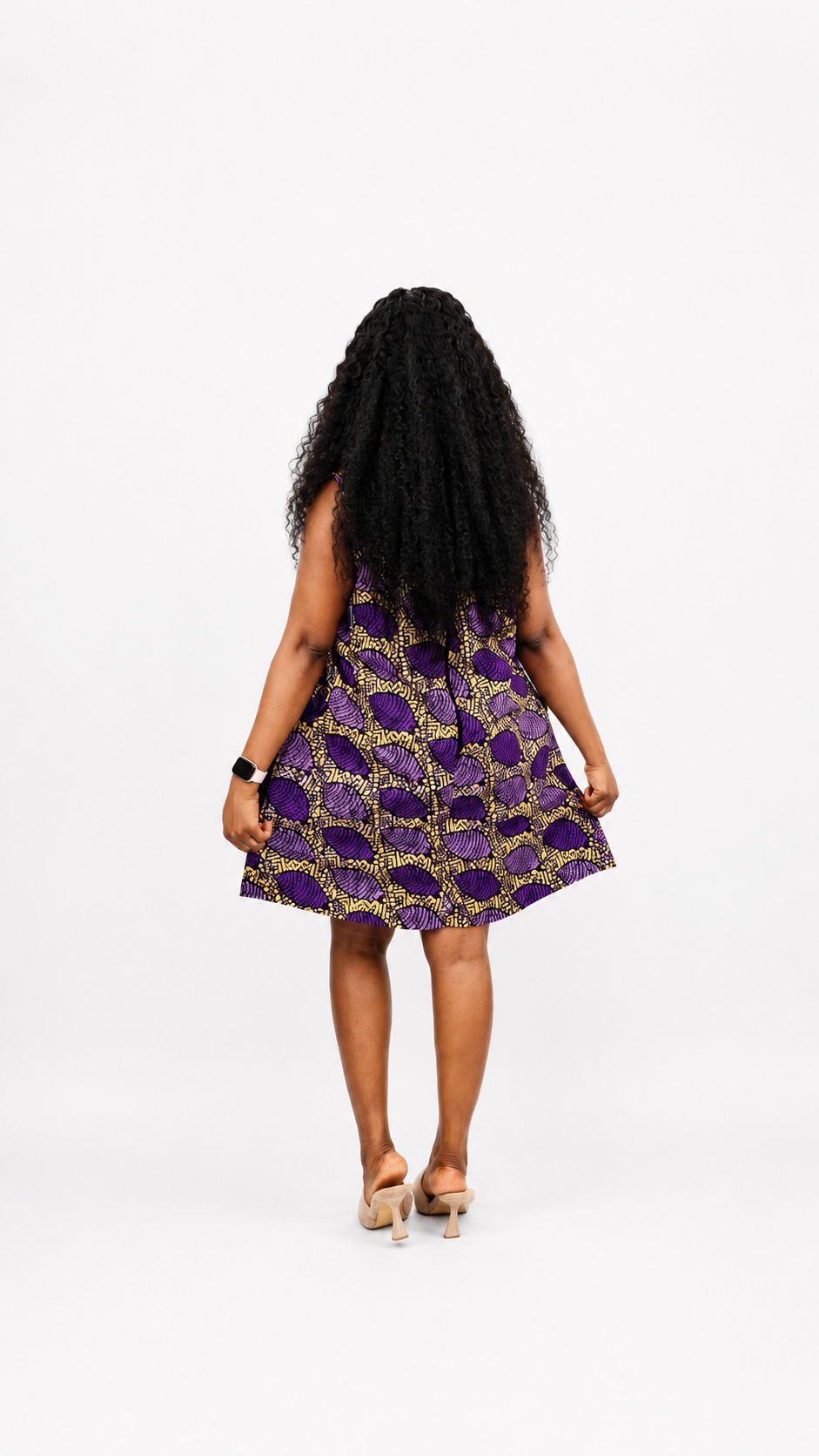 Rear view of the purple and yellow A-line mini dress illustrating the structured silhouette.