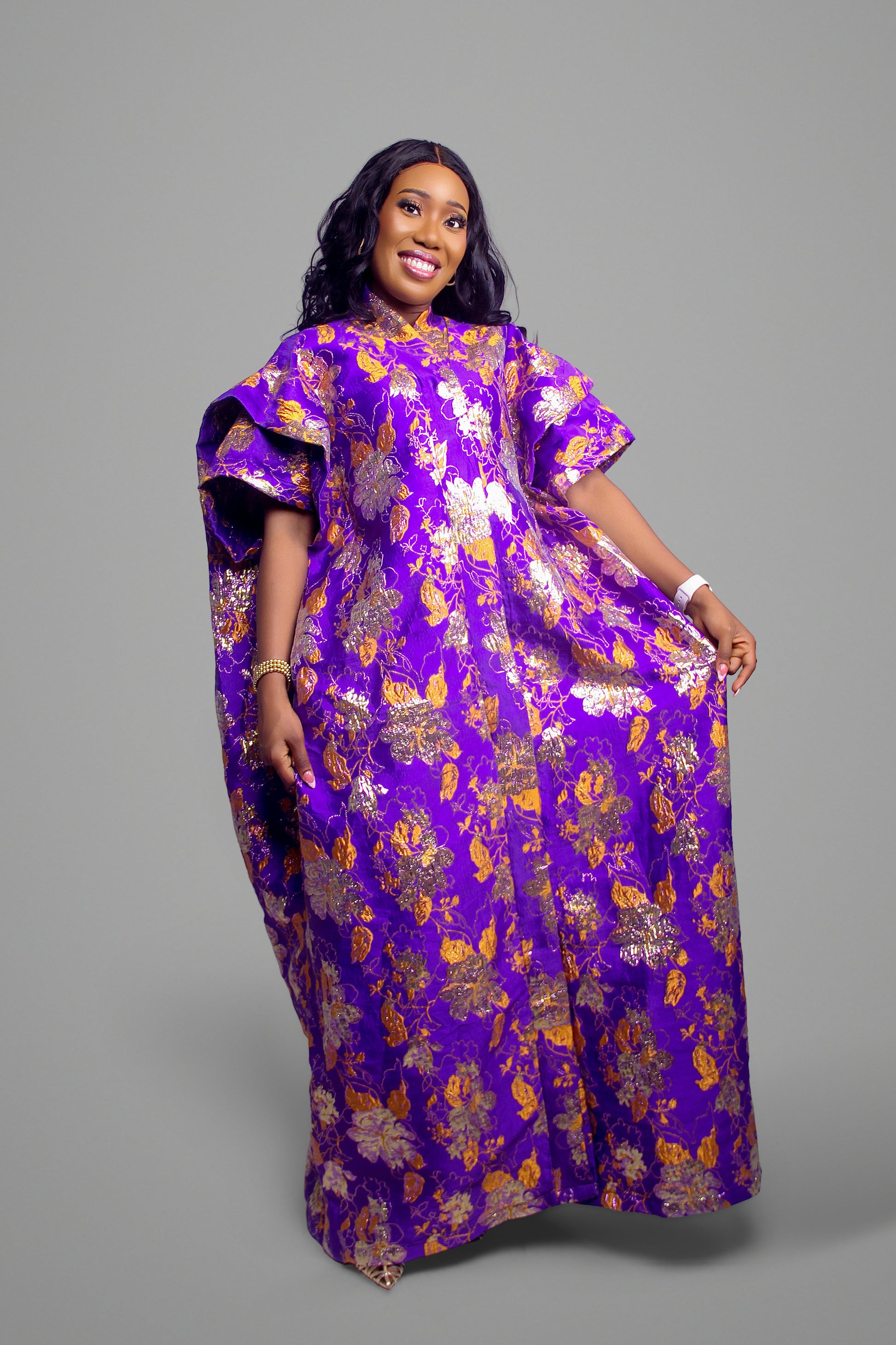 Side profile of the metallic purple floral brocade kaftan dress