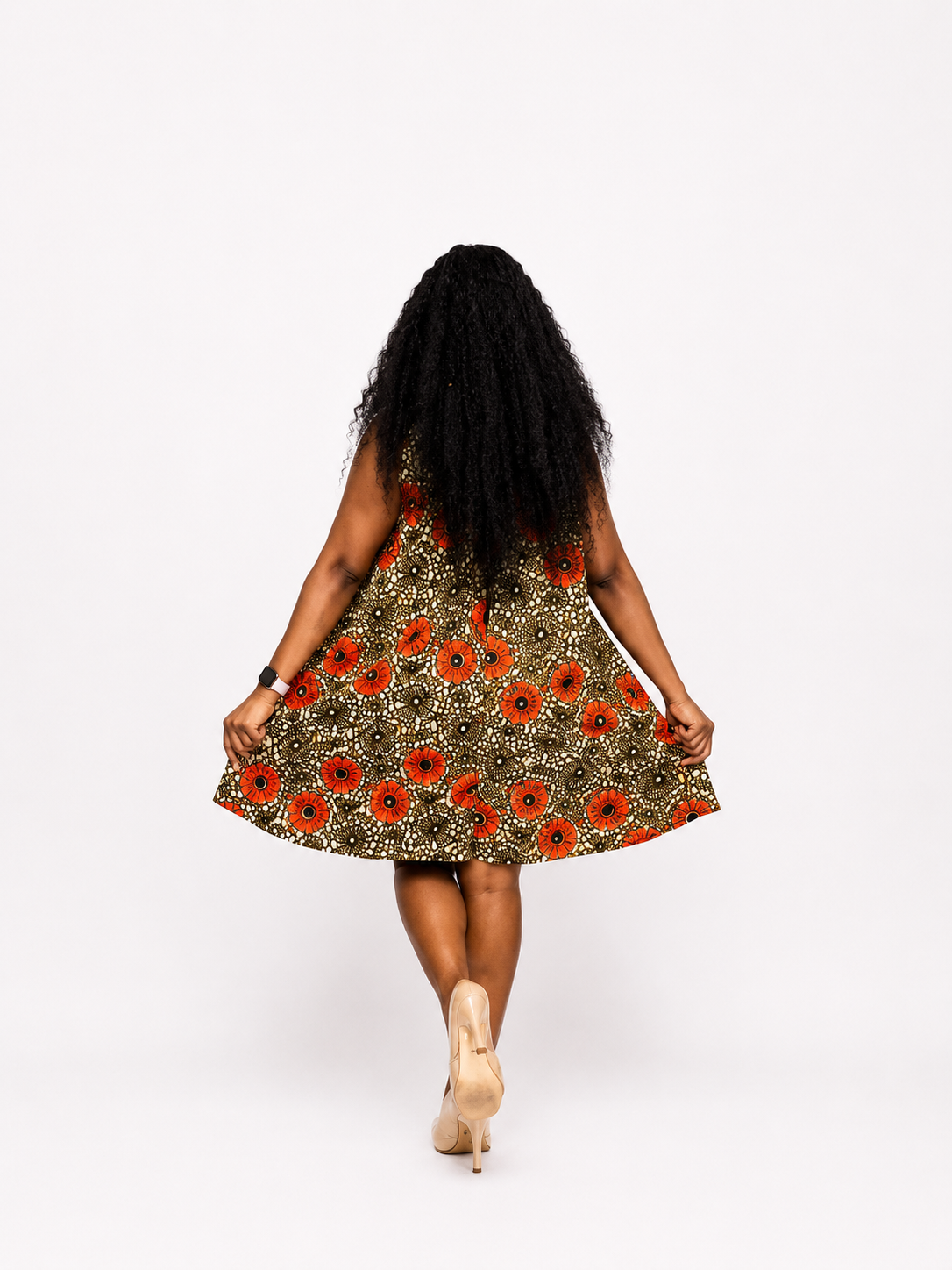 Rear view of the orange and black A-line mini dress demonstrating the fit and fabric drape.