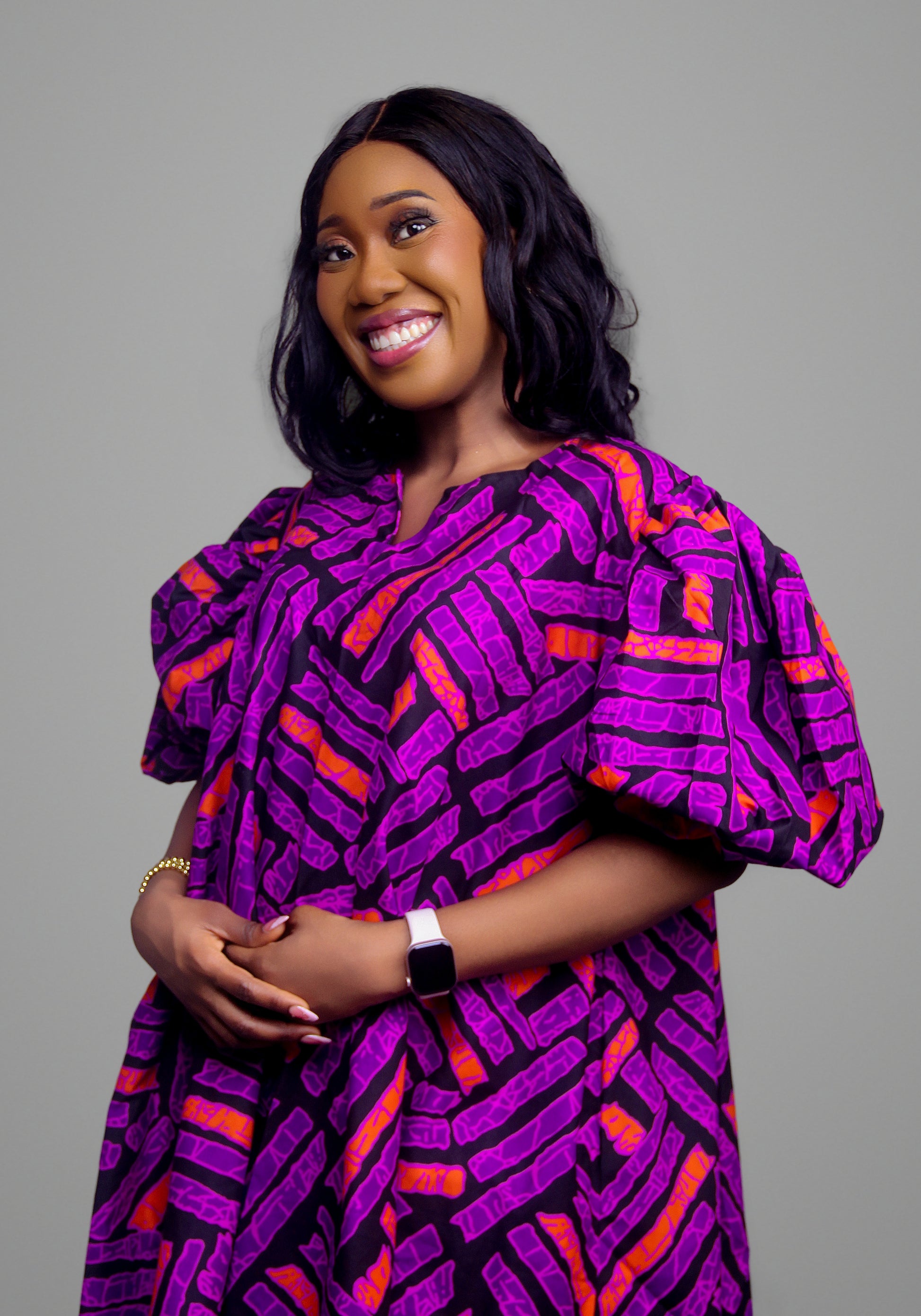 Geometric print dress in purple and orange with puff sleeves