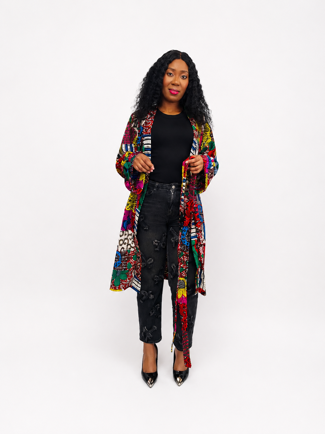 Open view of the African print patchwork wrap coat showing the matching tie belt and detailed textile patterns.