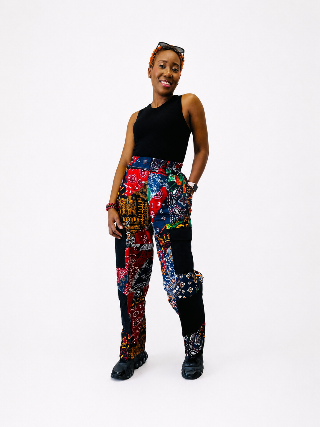 Front view of patchwork paisley cargo pants with black utility pockets