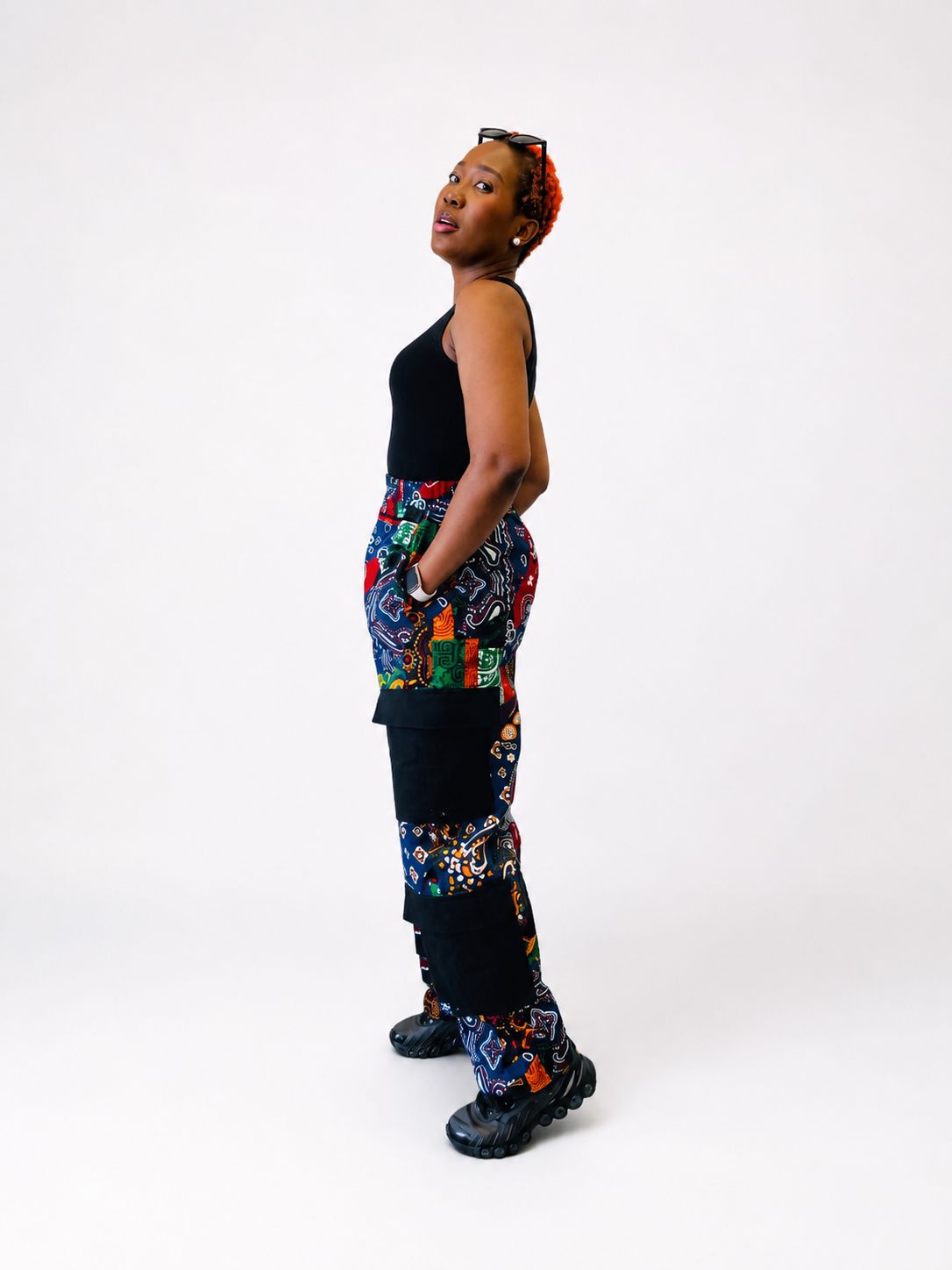 Detailed side view of the structured cotton patchwork and cargo pocket design