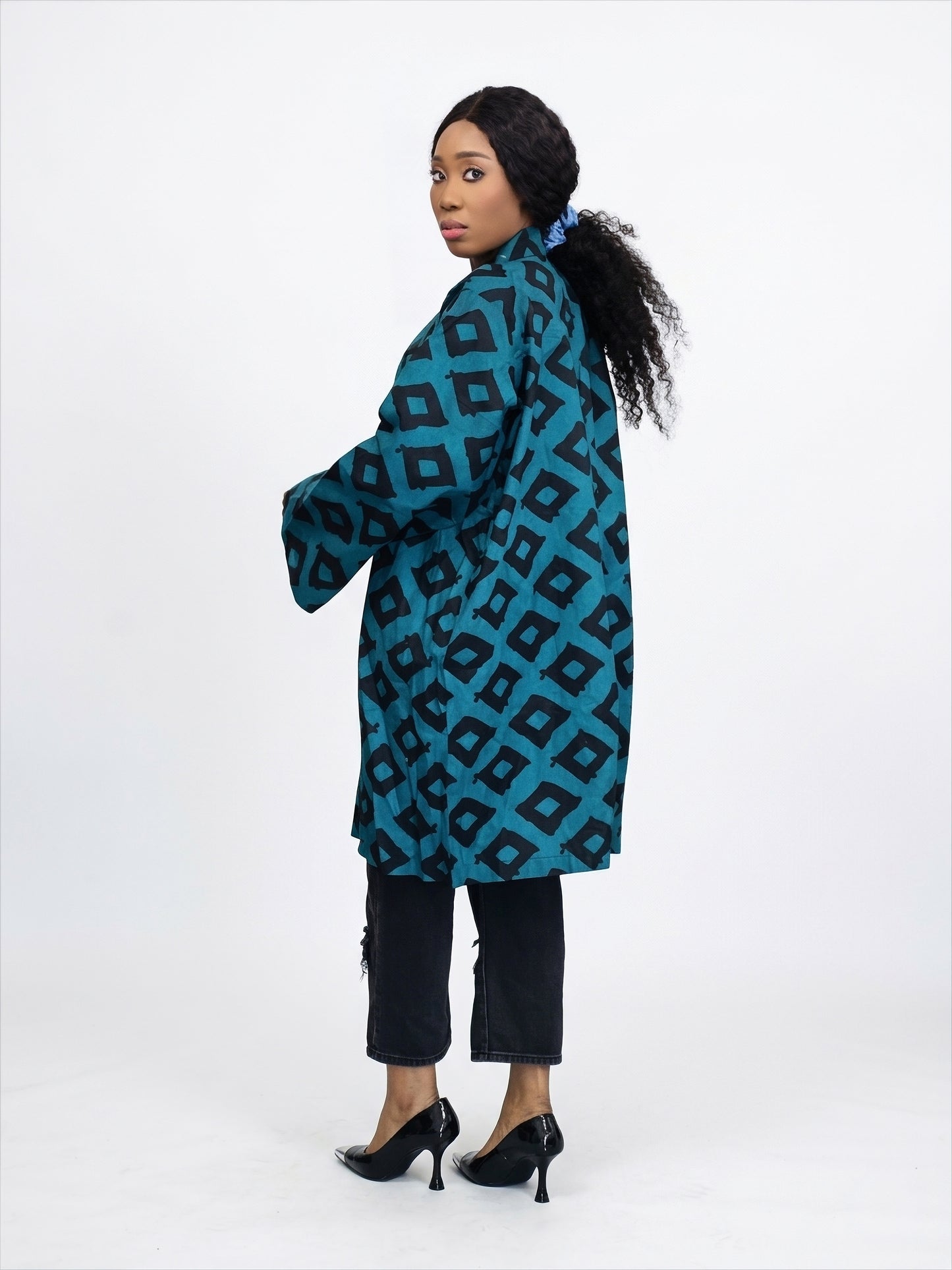 Side view of geometric print kimono jacket showing length and sleeve detail