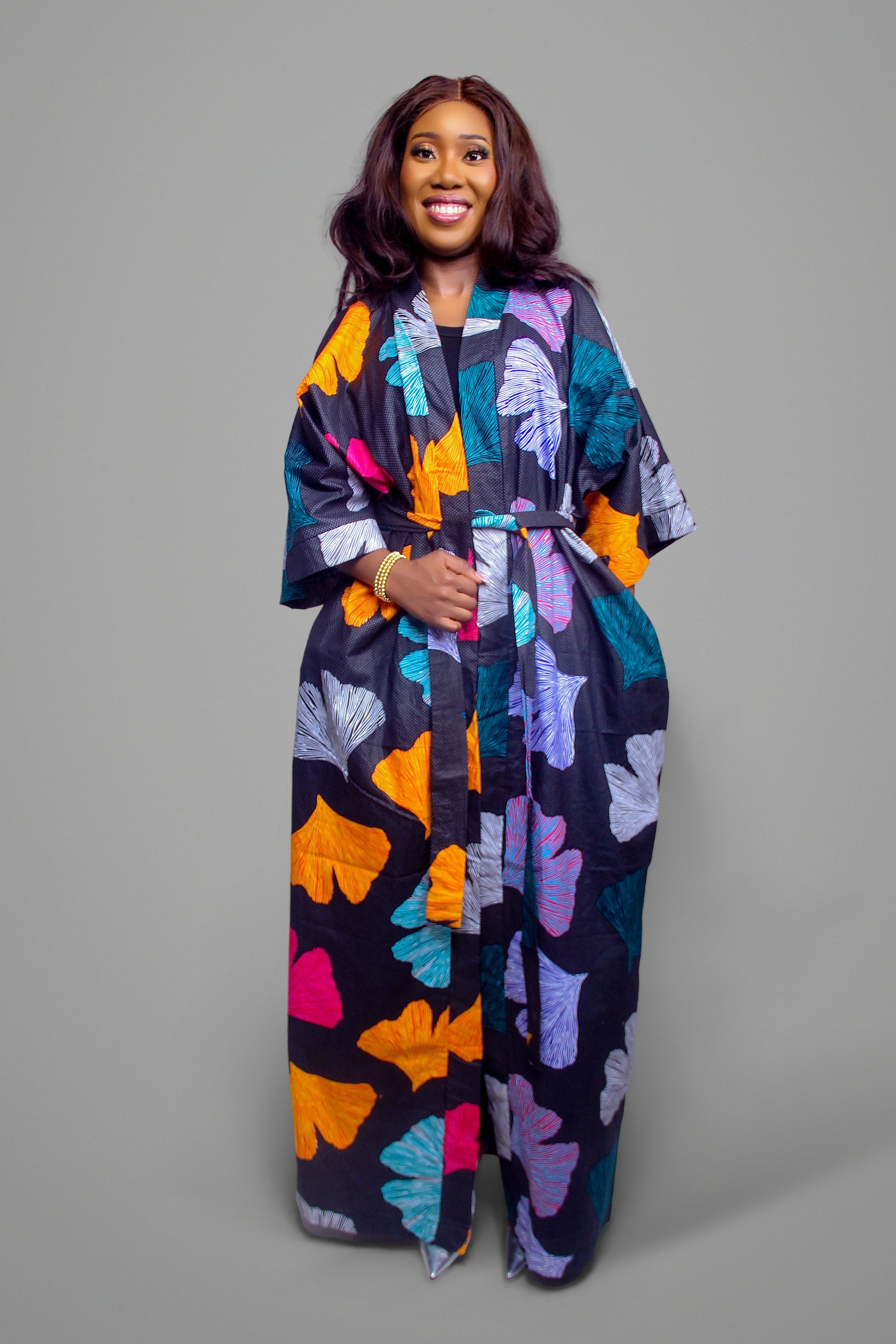 Front view of the ginkgo leaf print maxi kimono robe tied at the waist with a fabric belt