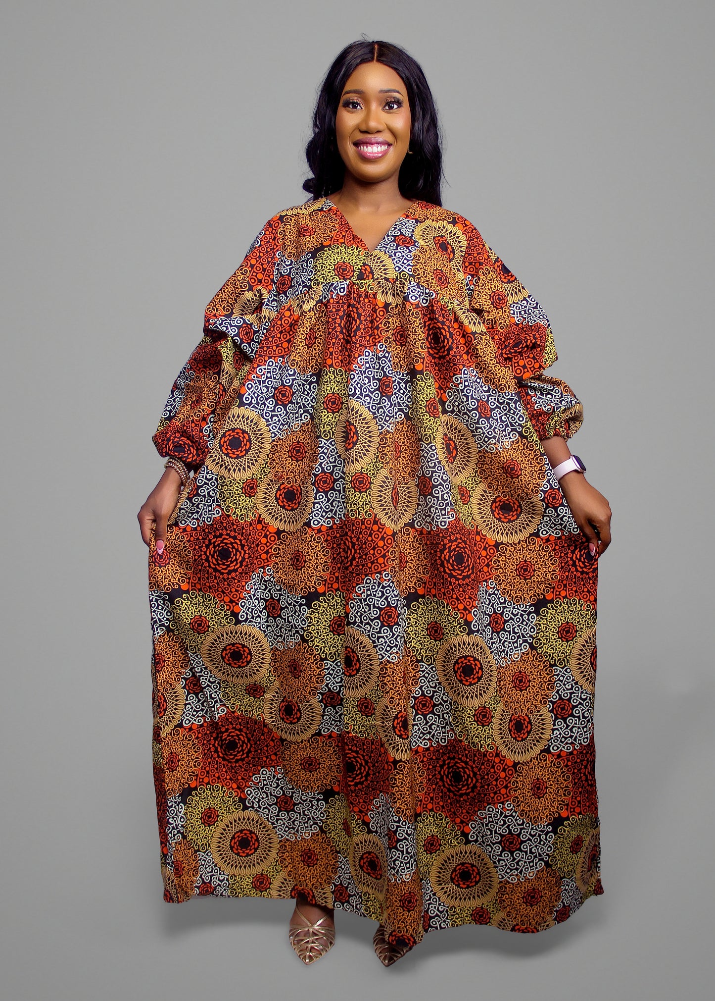 Maxi kaftan featuring a warm-toned orange and yellow geometric African print