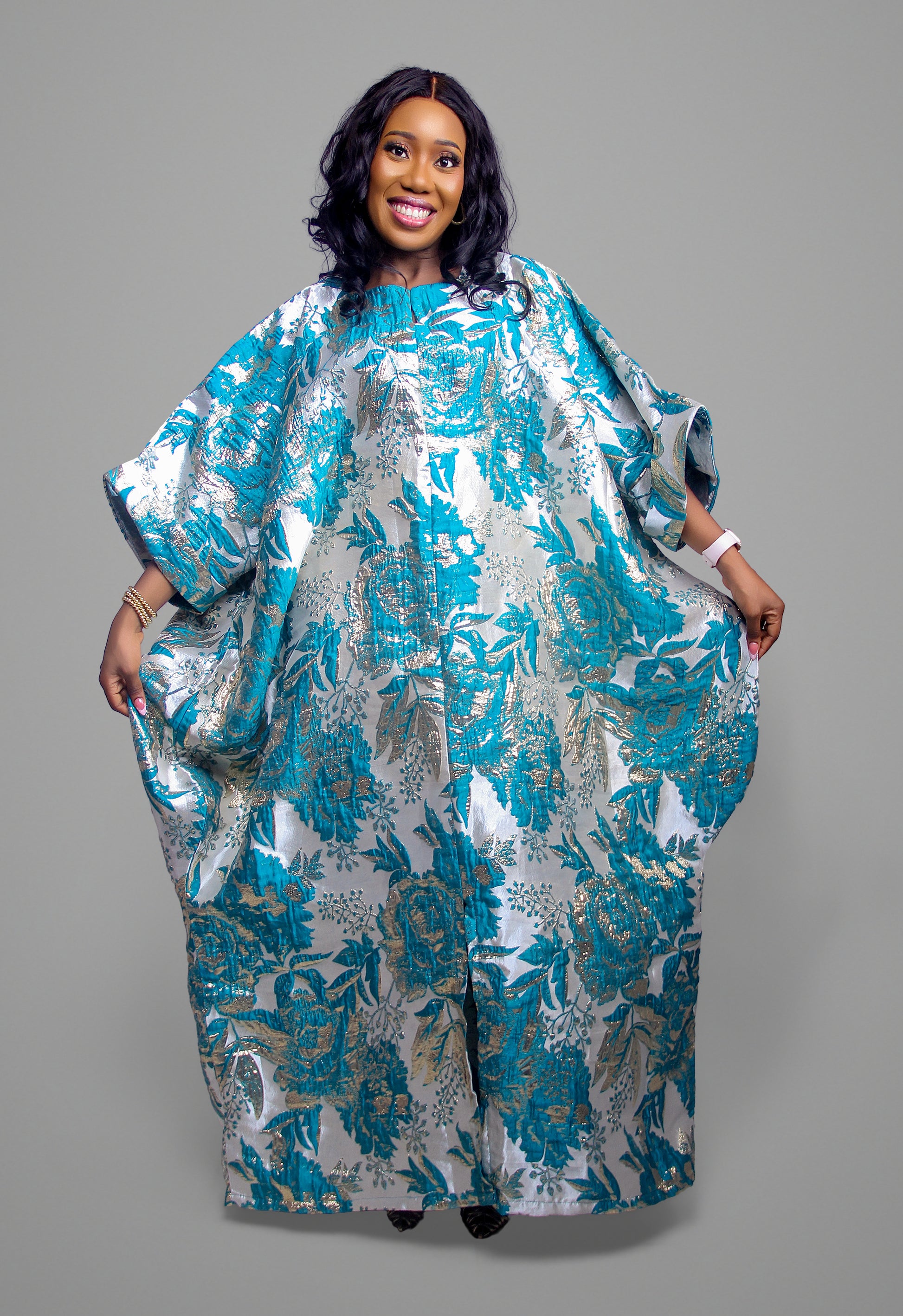 Front view of the metallic teal and silver floral brocade kaftan dress
