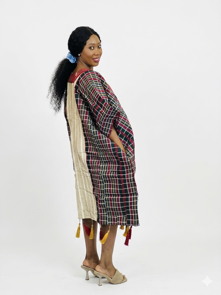 Side profile showing the alternative plaid-patterned side of the kaftan dress.
