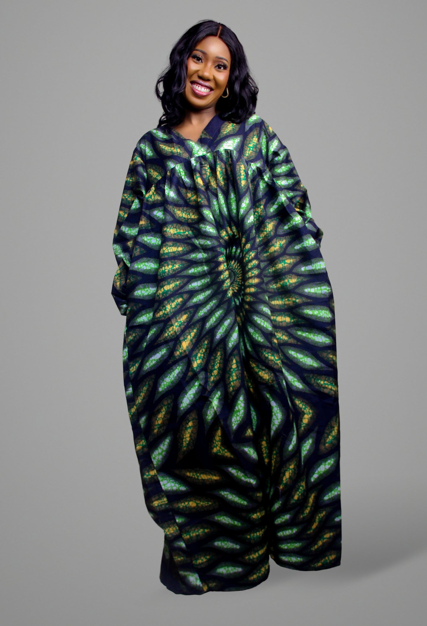Full length view of a green and black botanical-inspired concentric print maxi kaftan