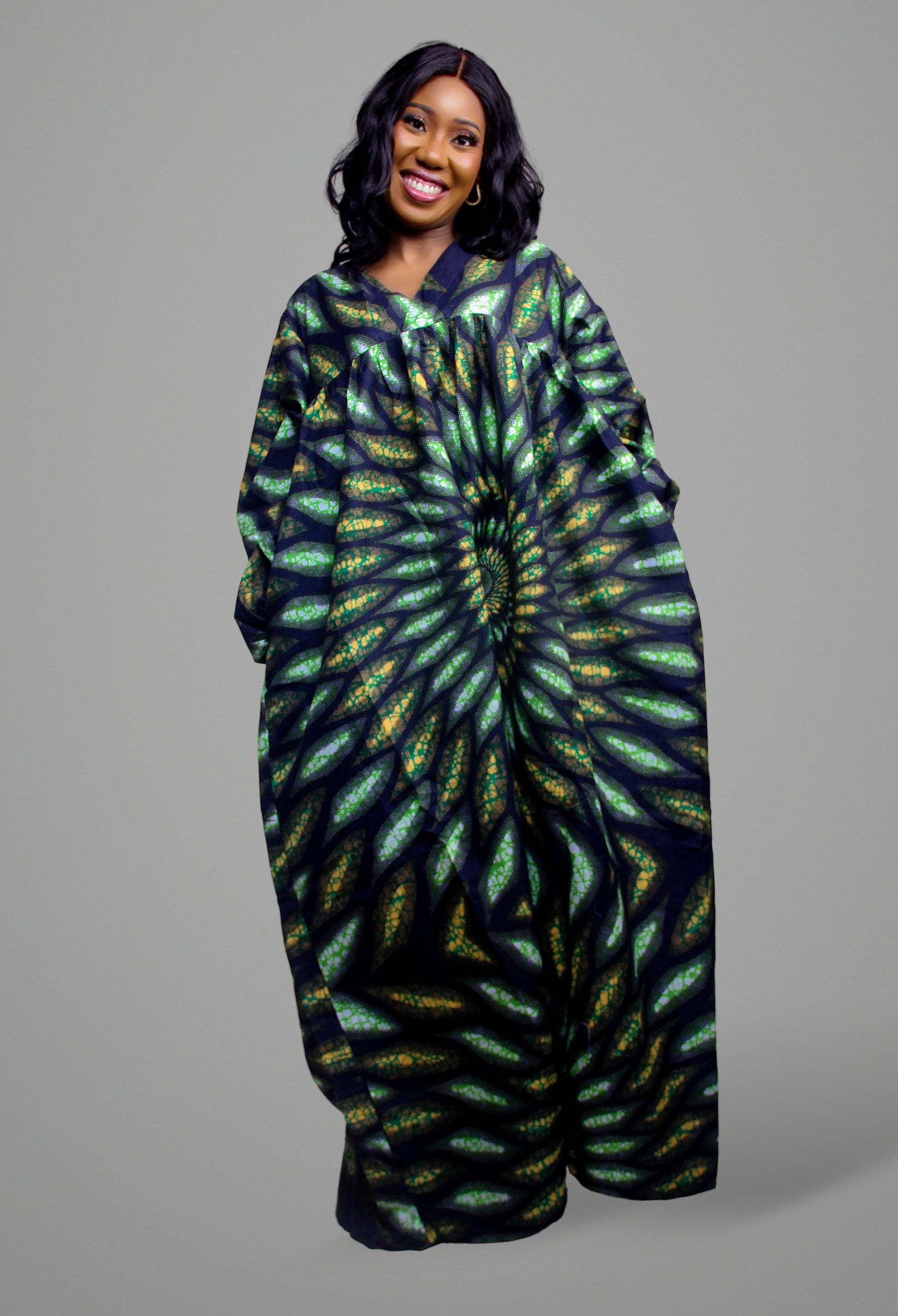 Full length view of a green and black botanical-inspired concentric print maxi kaftan